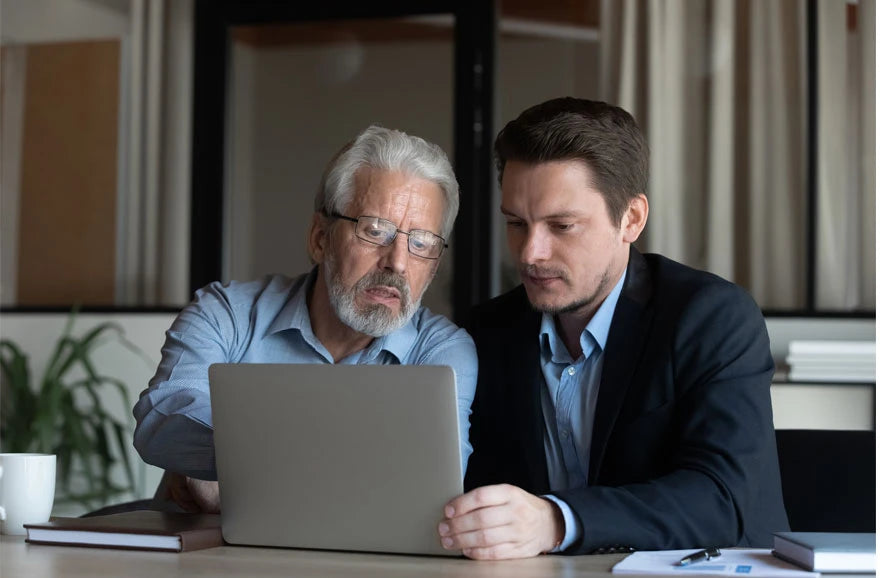 Father and son researching church security and CCW insurance options online