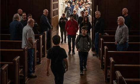 People entering a church, highlighting the importance of congregation security