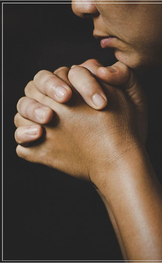 Female church member praying, emphasizing need for congregation security and CCW insurance